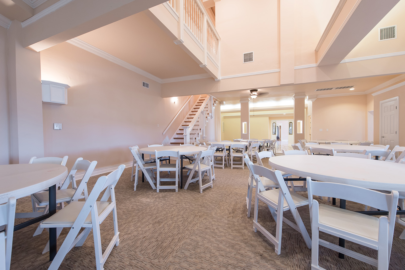Grand staircase and marble ballroom interior at Settles Point